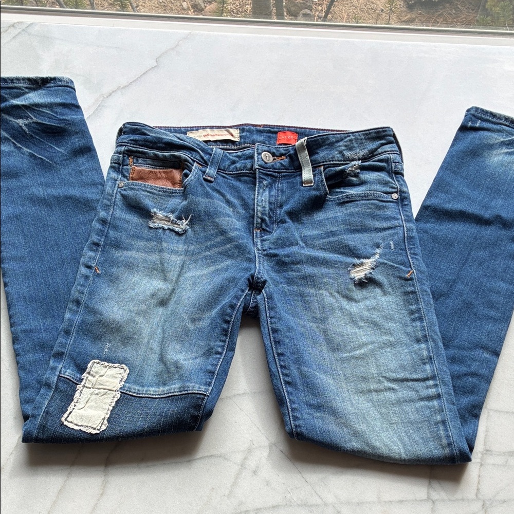 Pilcro and the Letterpress Distressed Patchwork Jeans with Leather Detail.